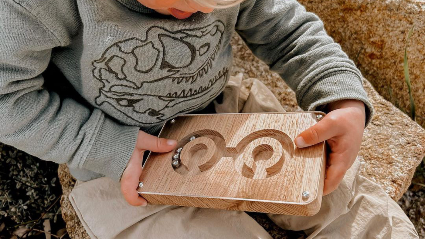 Young boy playing with balance game